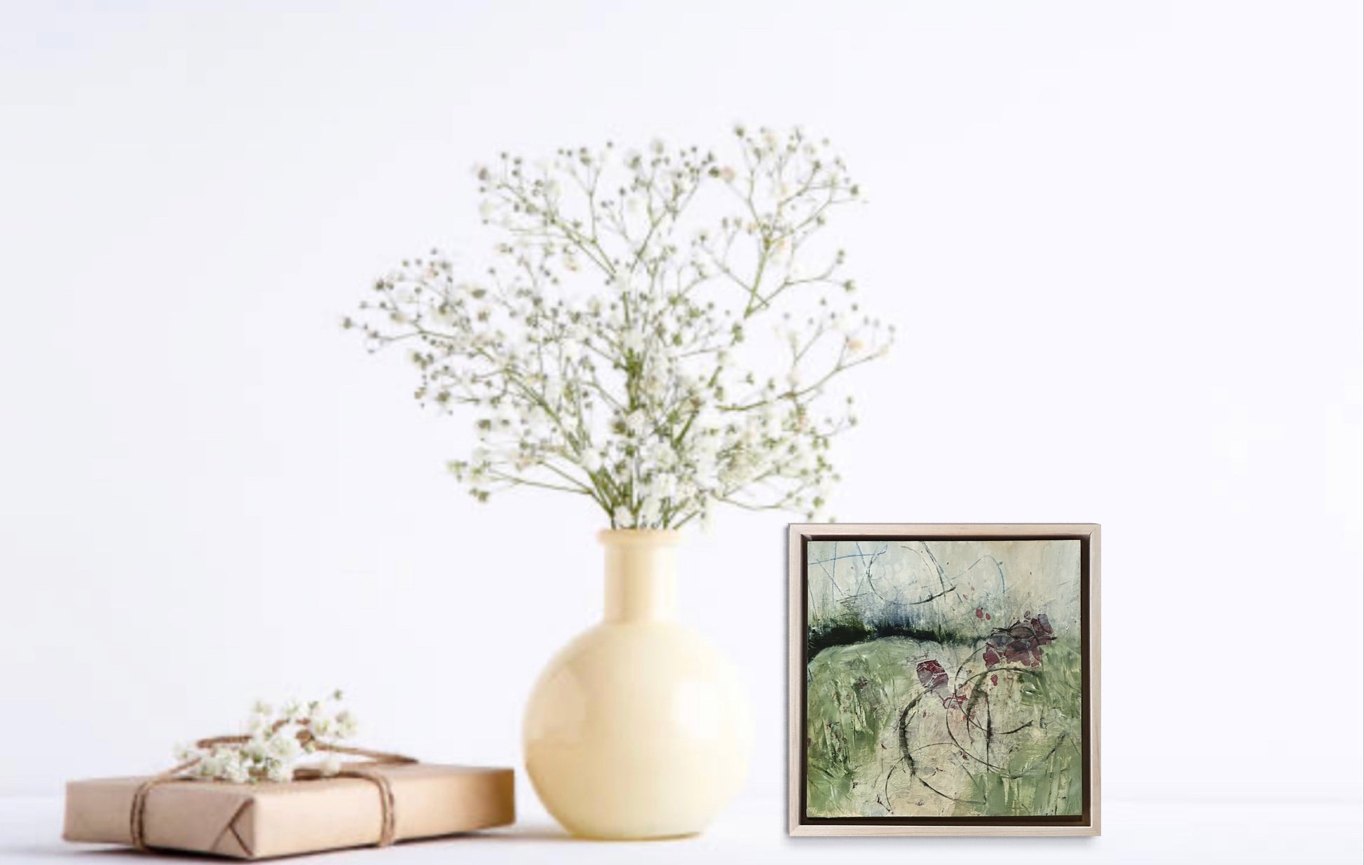 8 x 8 x 1.5-inch, insitu loose impression of a field bordered by distant mountains and random wildflowers.  Acrylic painting on cradled panel with natural wood frame.  By Cumming, GA artist, Juanita Bellavance. Part of our 25 Days of Minis 2022 collection.  Collect them all!
