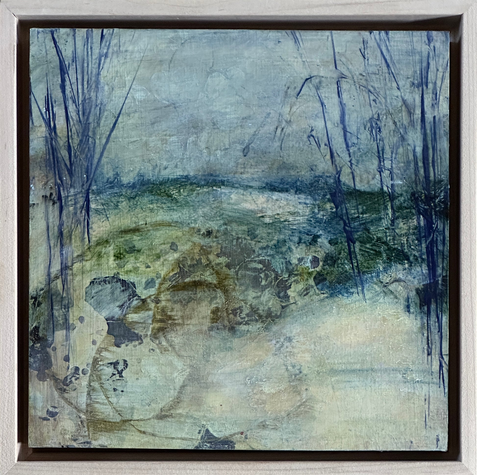 8 x 8 x 1.5-inch, framed, impression of dry land adjacent to the water along a riverbank.  Acrylic painting on cradled panel with natural wood frame.  By Cumming, GA artist, Juanita Bellavance. Part of our 25 Days of Minis 2022 collection.  Collect them all!