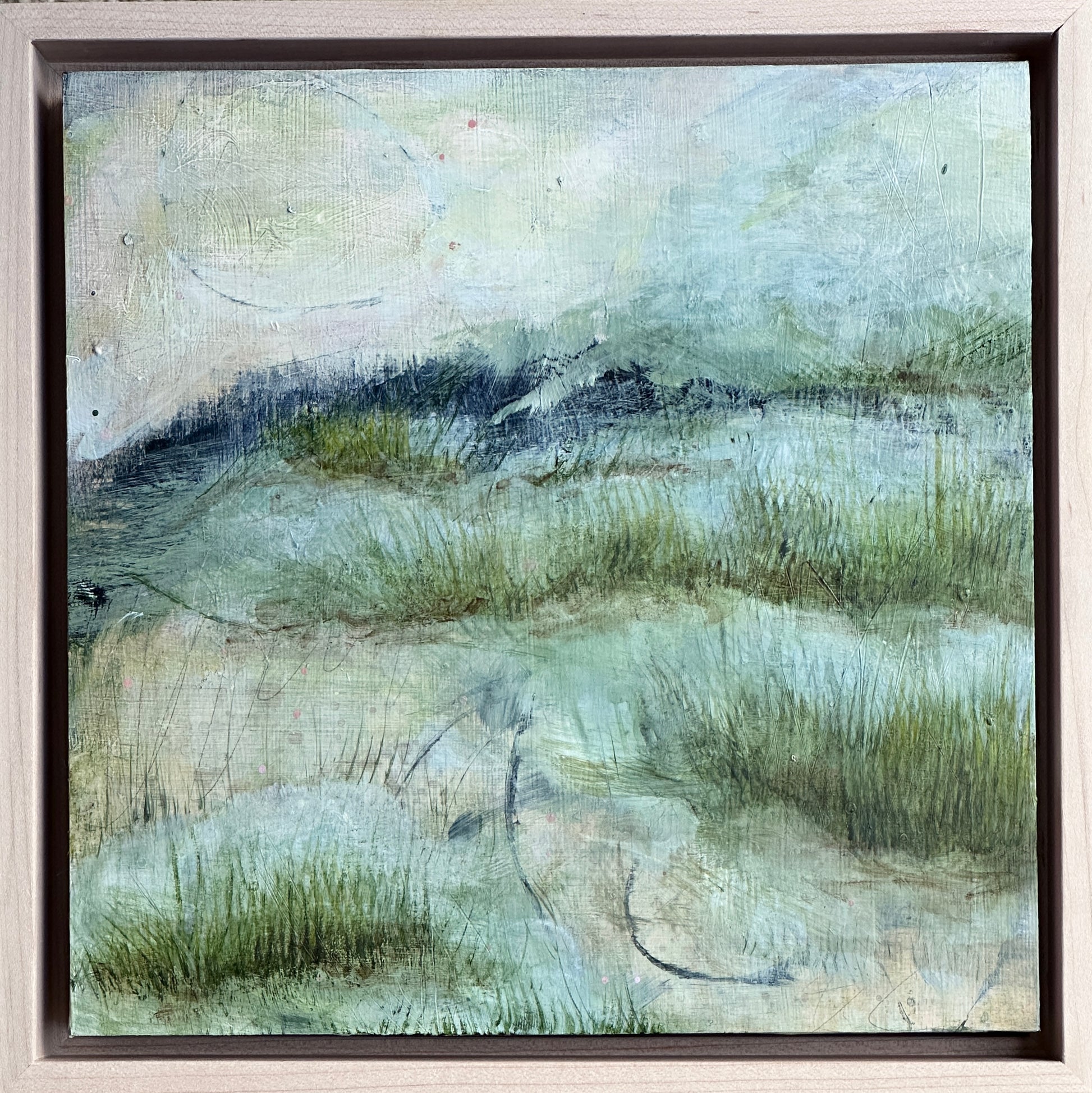 8 x 8 x 1.5-inch, framed, impression of marshes fading away into the sea.  Acrylic painting on cradled panel with natural wood frame.  By Cumming, GA artist, Juanita Bellavance. Part of our 25 Days of Minis 2022 collection.  Collect them all!
